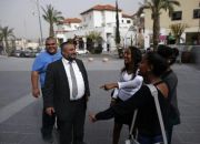 ncumbent-haredi-ultra-orthodox-mayor-moshe-abutbul-2nd-from-left-talking-with-some-residents-march-3-2014